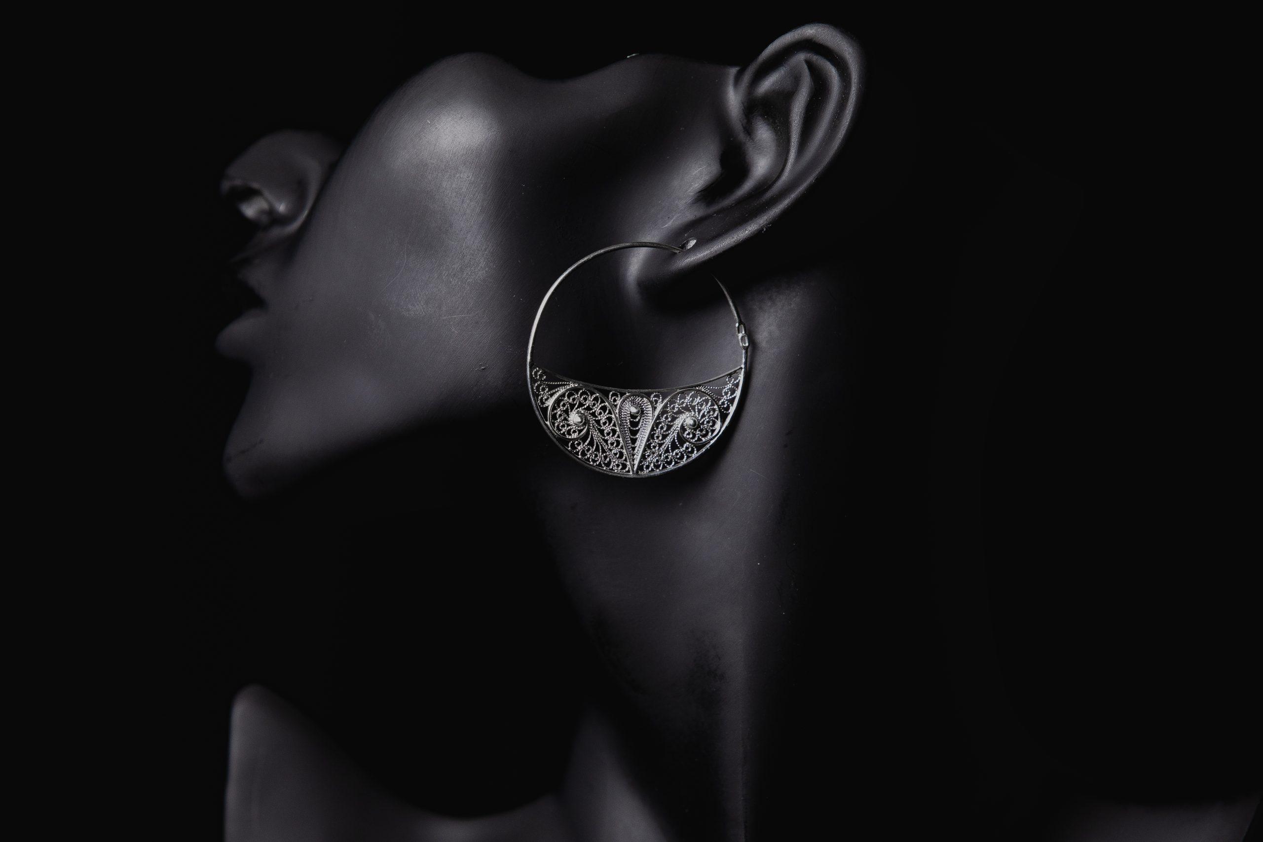 Fine jewelry promotion in the ears of a woman. High quality photo